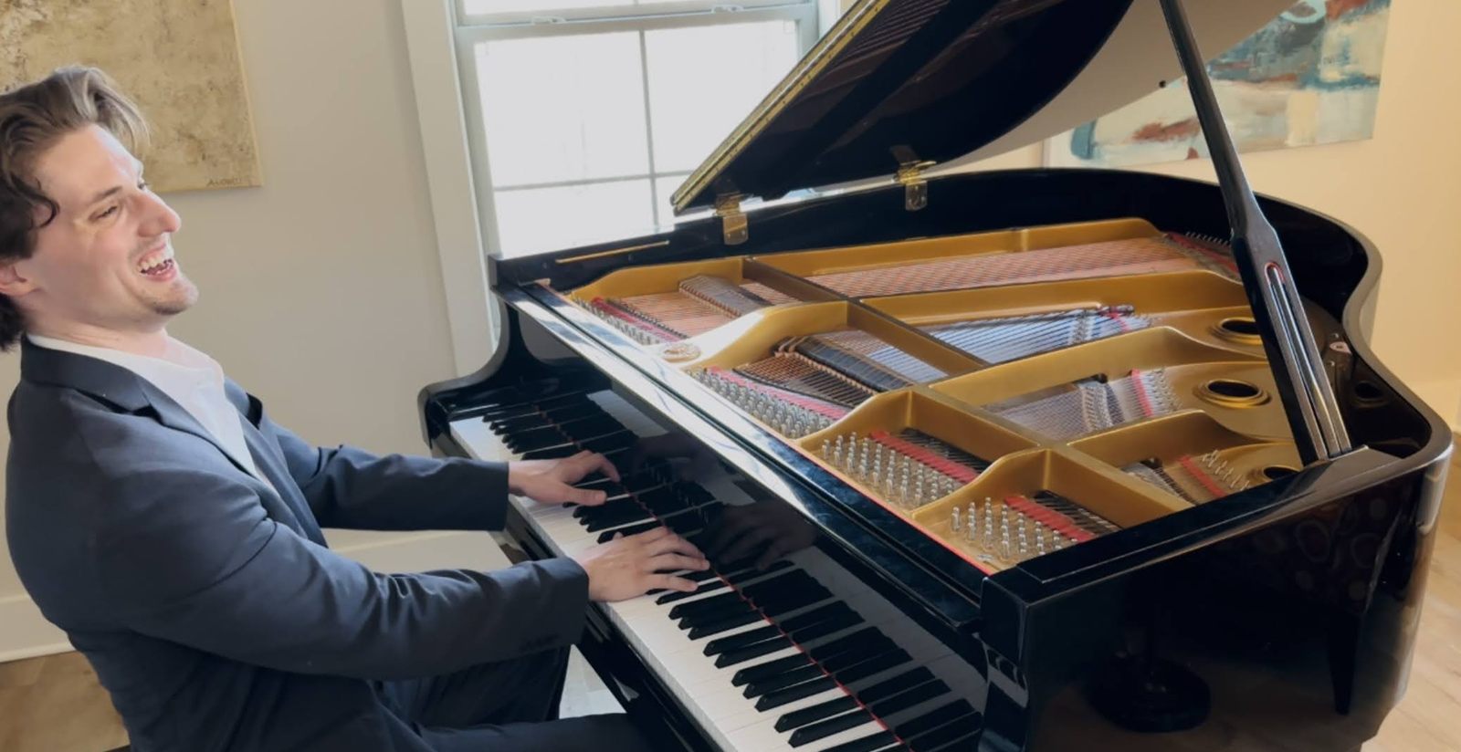 Canaan Howell performing at a grand piano